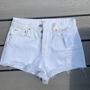 GRLFRND White denim shorts.